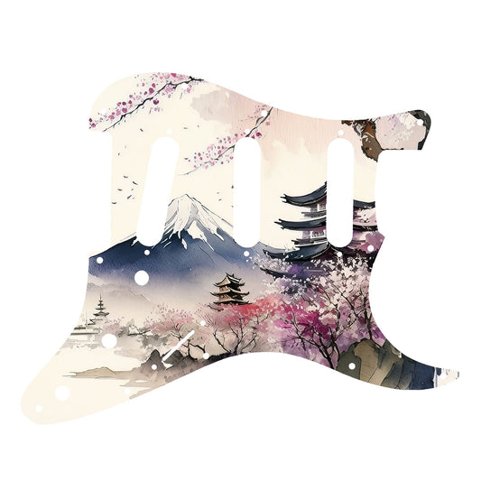 Egyedi Fender Stratocaster gitár koptató cseresznyevirágzó fákkal, hagyományos pagodákkal és hófödte hegycsúccsal a háttérben