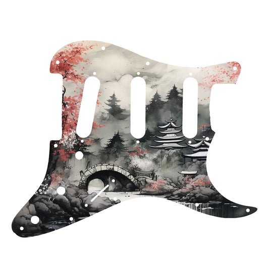 Egyedi Fender Stratocaster gitár koptató japán cseresznyefával, kőhíddal és hegyekkel a ködös tájban