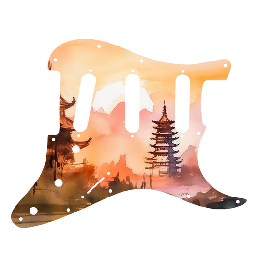 Egyedi Fender Stratocaster gitár koptató naplemente árnyalataival, hagyományos pagodákkal és hegyvonulatokkal a háttérben