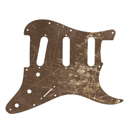 Egyedi Fender Stratocaster gitár koptató barnás tónusokkal, erőteljes karcnyomokkal és rusztikus textúrával