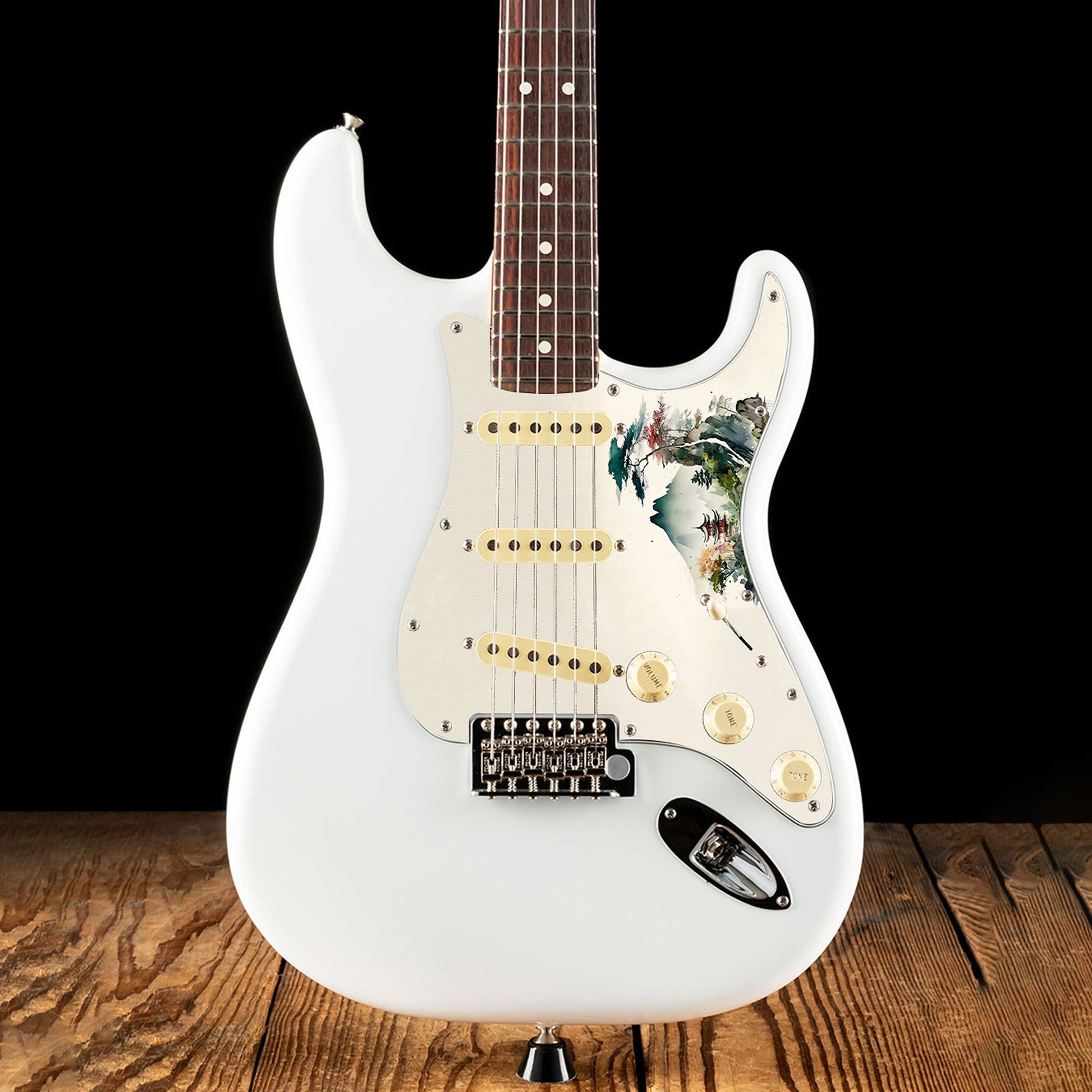 Egyedi Fender Stratocaster gitár koptató hegyekkel, tóparti pagodával és színes lombú fákkal a nyugodt tájban