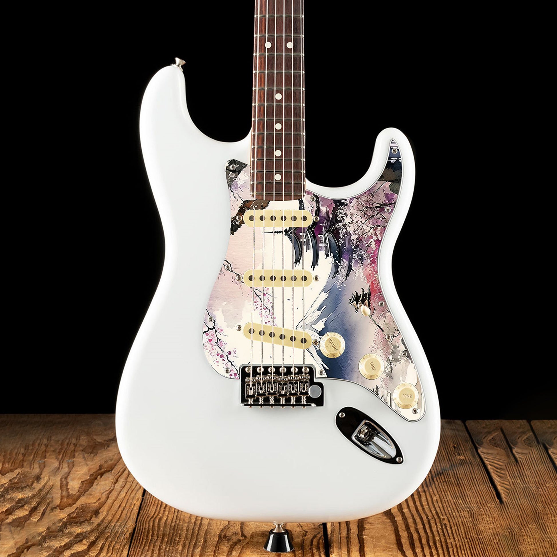 Egyedi Fender Stratocaster gitár koptató cseresznyevirágzó fákkal, hagyományos pagodákkal és hófödte hegycsúccsal a háttérben