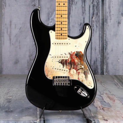 Egyedi Fender Stratocaster gitár koptató vörös pagodával, őszi lombú fákkal és madárrajjal a narancsos égbolt alatt