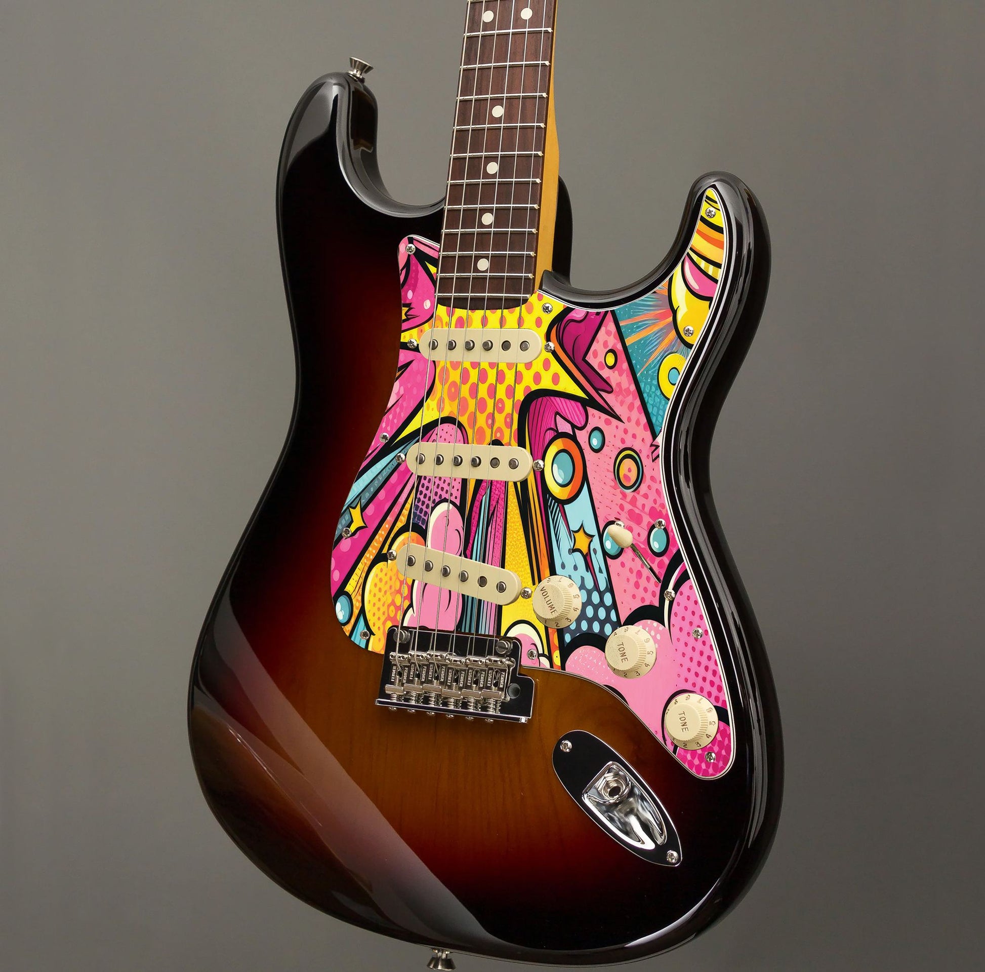 Egyedi Fender Stratocaster gitár koptató képregény stílusú robbanásszerű grafikával, élénk színekkel és modern vonalvezetéssel